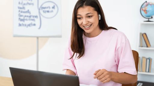 A woman teaching online on her laptop